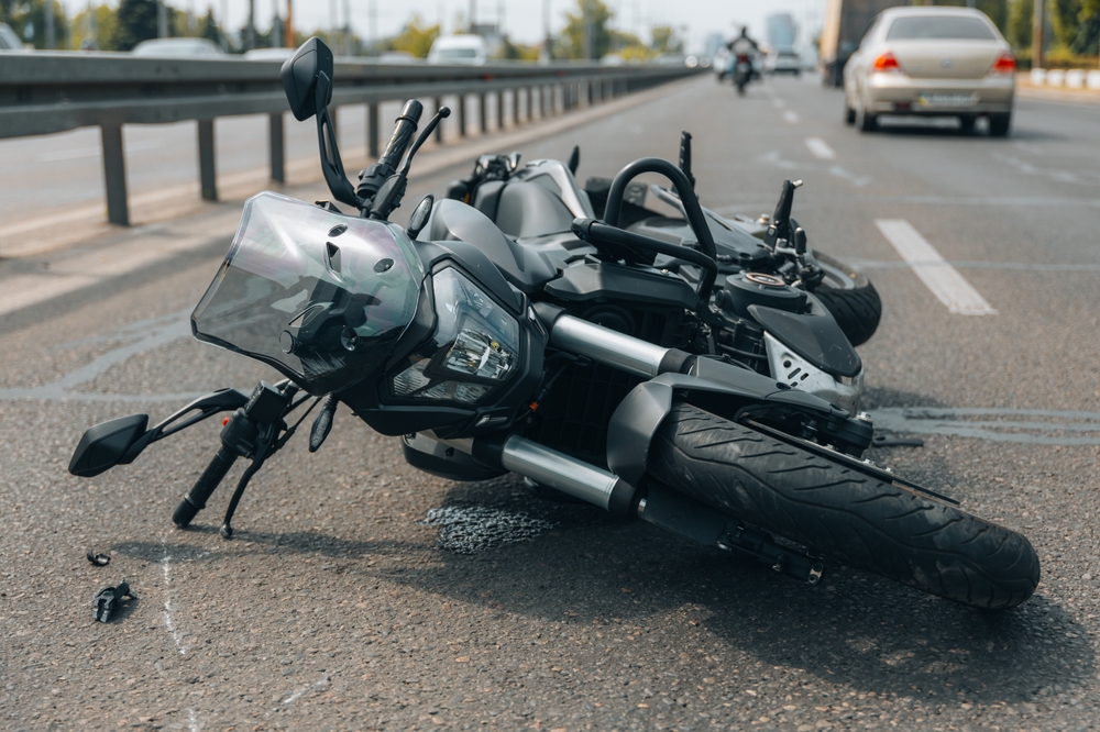 Motorcycle one the side of the rode after being involved in an accident 